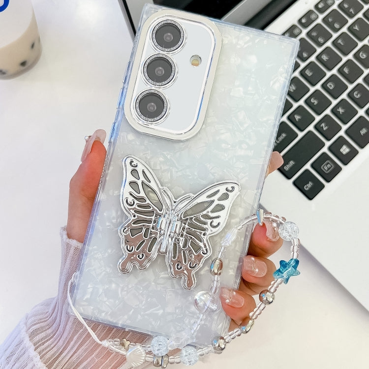 For Samsung Galaxy S25+ 5G Plating Glitter Lens Film Texture Butterfly Holder Wristband Phone Case(White Shell Pattern) - Galaxy S25+ 5G Cases by PMC Jewellery | Online Shopping South Africa | PMC Jewellery | Buy Now Pay Later Mobicred